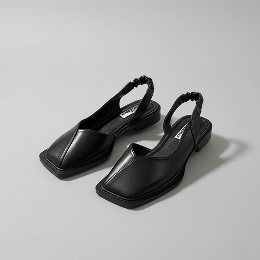 Black square toe slingback sandals with braided strap on gray background